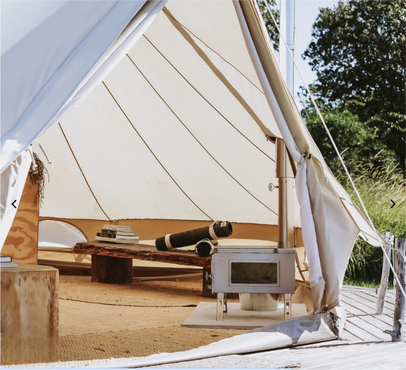What types of glamping tents can be used with wooden stoves?